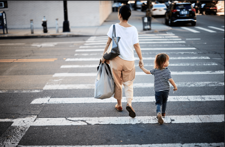 woman and child crossing the street